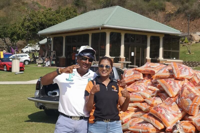 Annual rice drive organiser Lisa Sukdev with Gerald Anthony, who donated 13 tonnes for the cause.